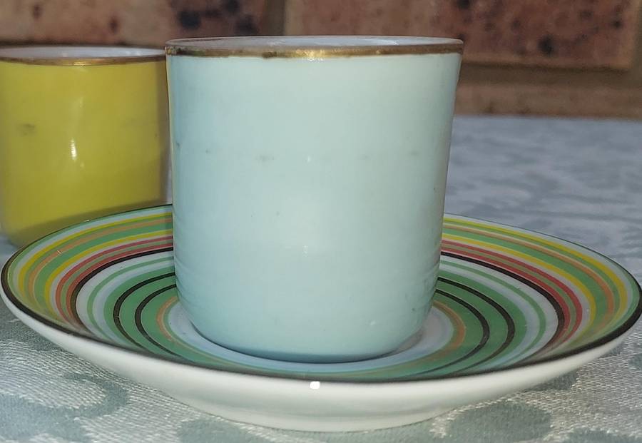 A 17 PIECE DEMATASSE EXPRESSO PORCELAIN CUP AND SAUCER COLECTION SOLD AS IS