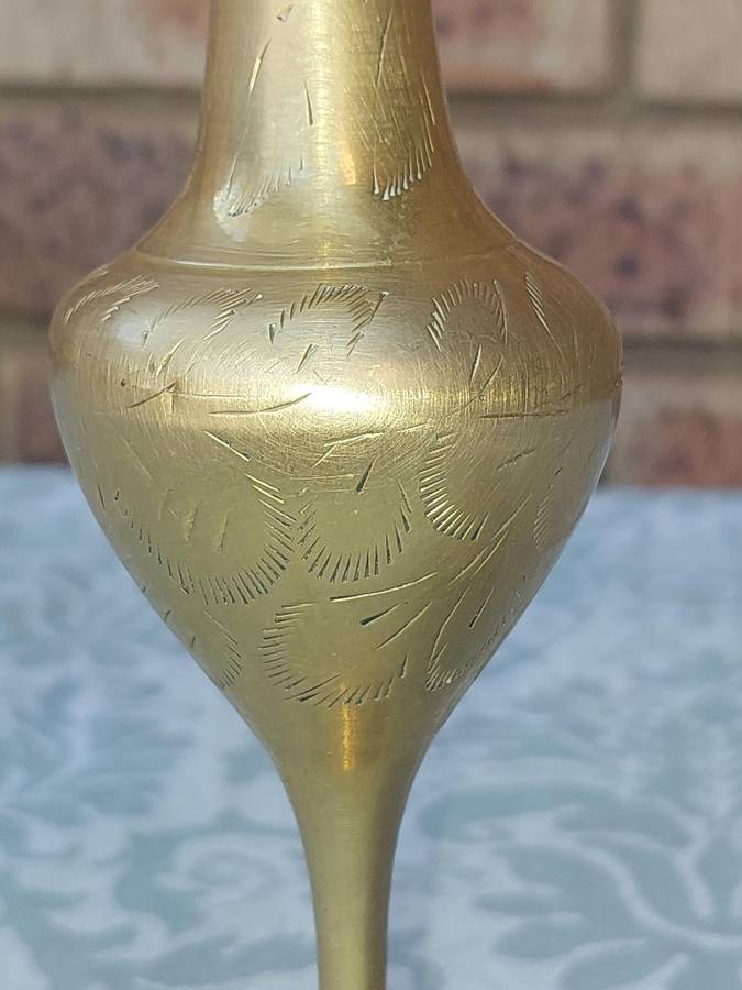 A VINTAGE BRASS VASE AND A BELL SOLD AS IS