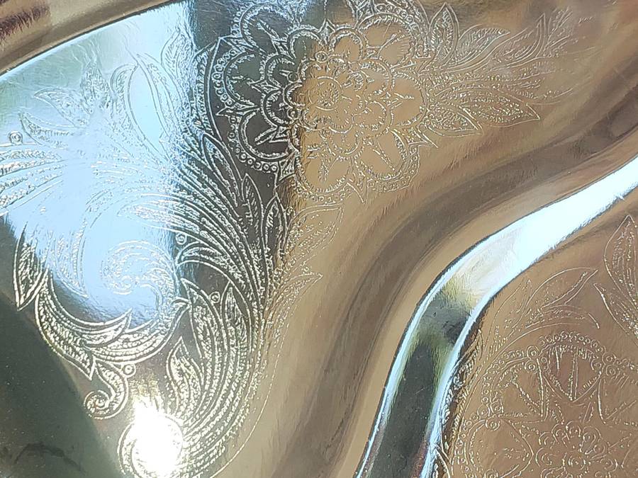 AN ART DECOR TARNISH PROOF CARVING PLATTER SOLD AS IS