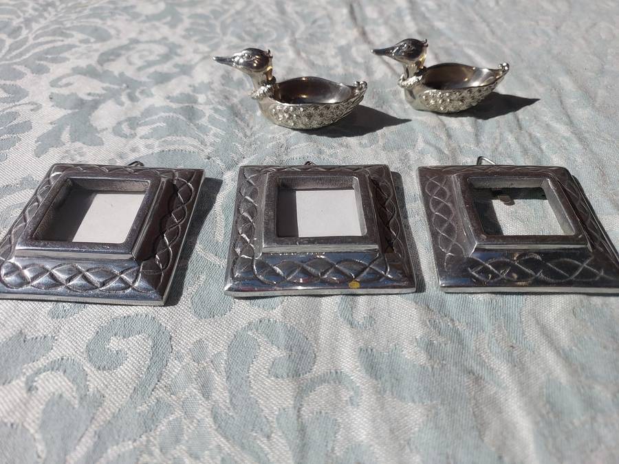 A COLLECTION OF PEWTER PHOTO FRAMES, FIGURINES  AND TWO SILVER PLATE DUCK SALTS