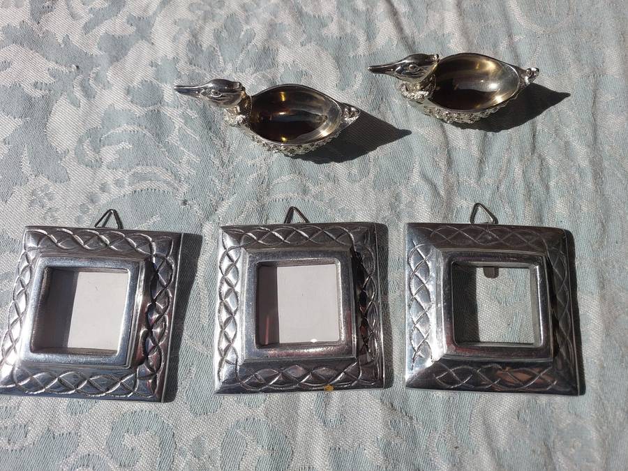 A COLLECTION OF PEWTER PHOTO FRAMES, FIGURINES  AND TWO SILVER PLATE DUCK SALTS