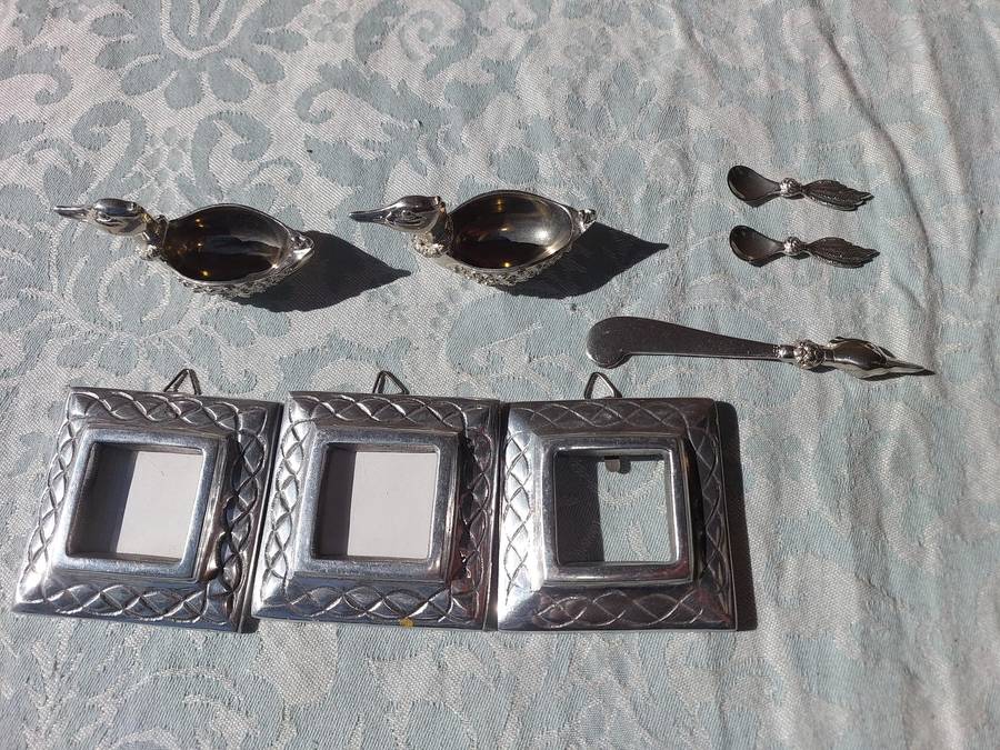 A COLLECTION OF PEWTER PHOTO FRAMES, FIGURINES  AND TWO SILVER PLATE DUCK SALTS