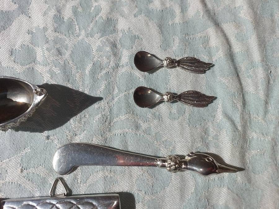 A COLLECTION OF PEWTER PHOTO FRAMES, FIGURINES  AND TWO SILVER PLATE DUCK SALTS