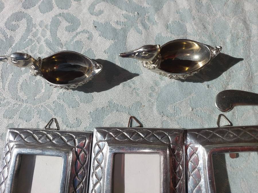 A COLLECTION OF PEWTER PHOTO FRAMES, FIGURINES  AND TWO SILVER PLATE DUCK SALTS