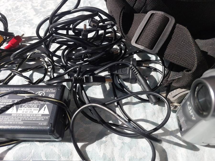 A SONY MODEL DCR-HC32E DIGITAL VIDEO CAMERA RECORDER IN WORKING ORDER WITH ALL CABLES , BATTERY AND