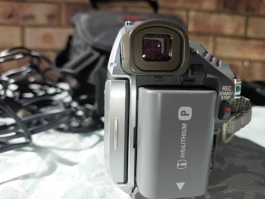 A SONY MODEL DCR-HC32E DIGITAL VIDEO CAMERA RECORDER IN WORKING ORDER WITH ALL CABLES , BATTERY AND