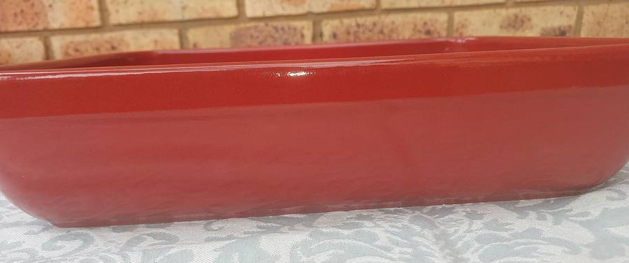 A EMILE HENRY RED CASSEROLE DISH MADE IN FRANCE SOLD AS IS