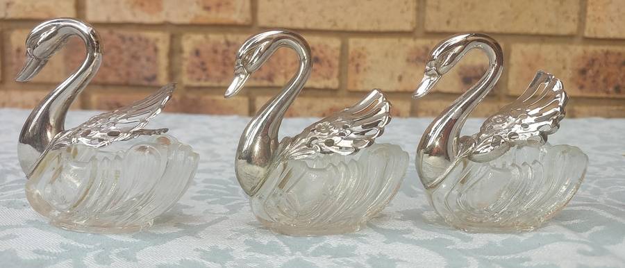 A set of 3 Swan Salt Cellars with out  Spoons Silver Plate vintage sold as is