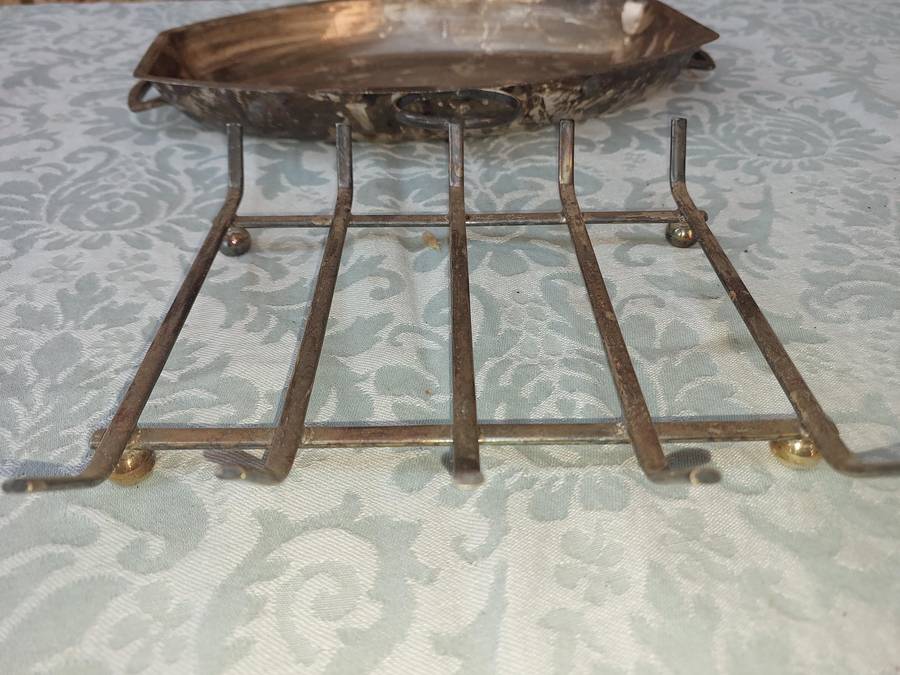 A VINTAGE SILVER PLATED SERVING PLATTER ON A SERVING STAND SOLD AS IS