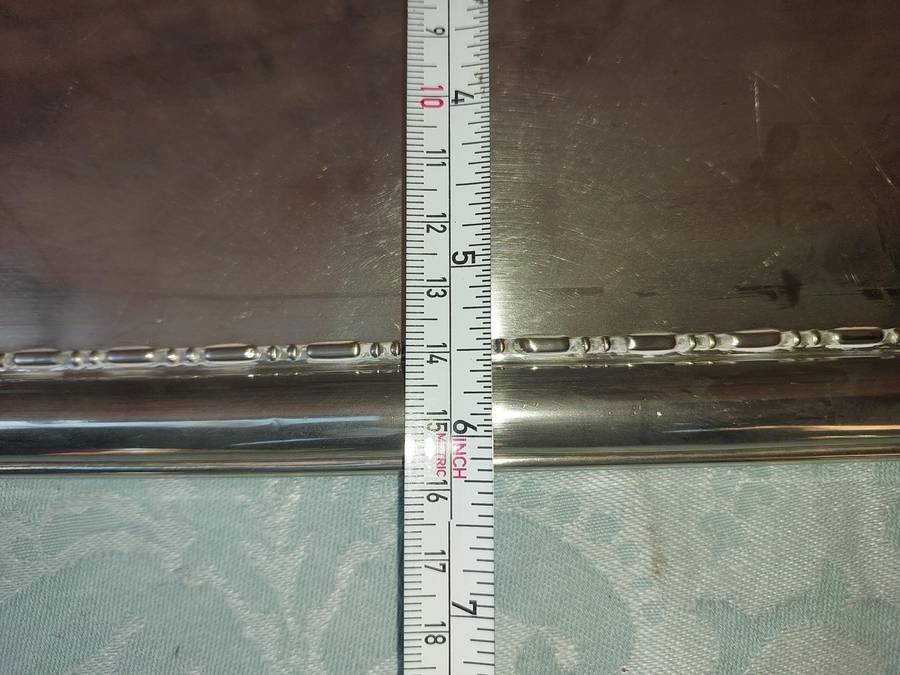 A SILVER PLATED RECTANGULAR SERVING PLATER SOLD AS IS
