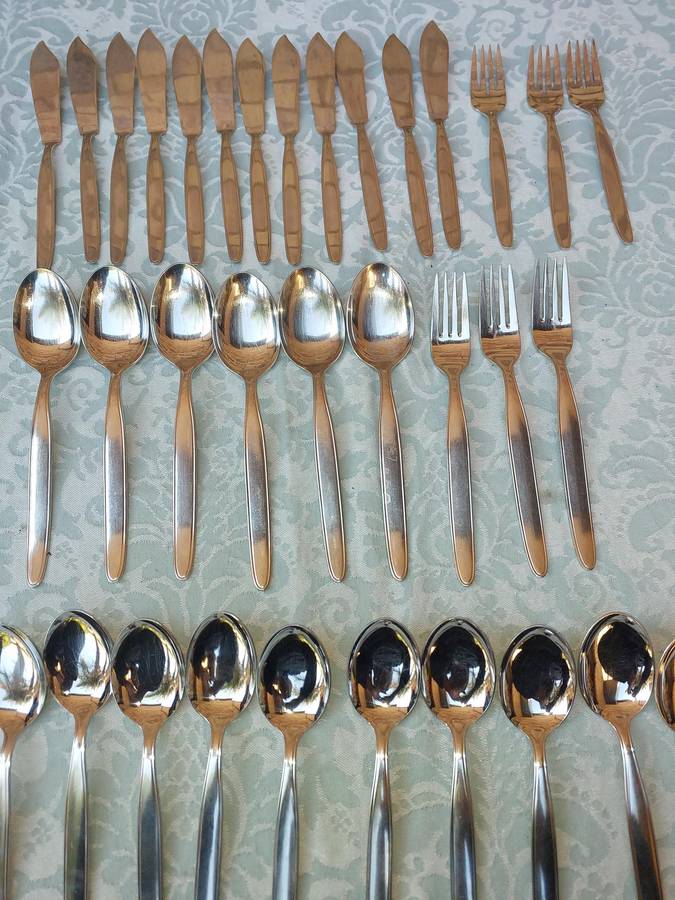 A SET 34 EICKHORN RONEUSIL STAINLESS STEEL CUTLERY SOLD AS IS