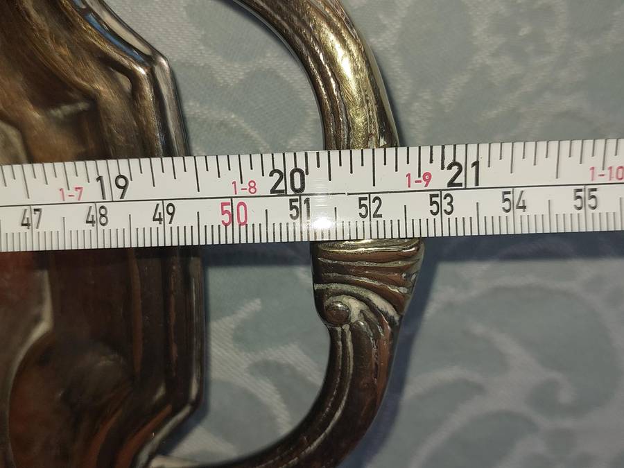 AN ANTIQUE 53 CENTIMETER SILVER PLATED ON BRONZE SERVING TRAY WIYH ENGRAVINGS SOLD AS IS