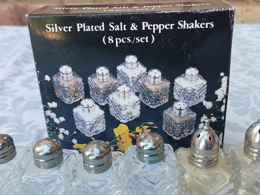 A SET OF 8 SALT AND PEPPER SHAKERS SOLD AS IS