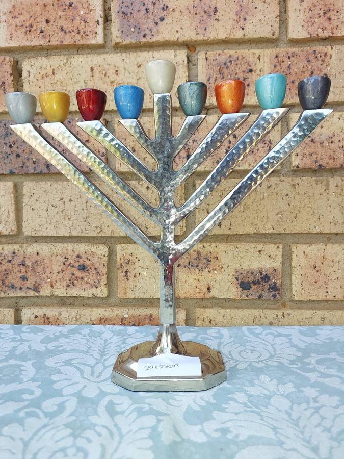 A BEAUTIFULL CHROME PLATED MINORA WITH LAQUERED CANDLE HOLDERS SOLD AS IS