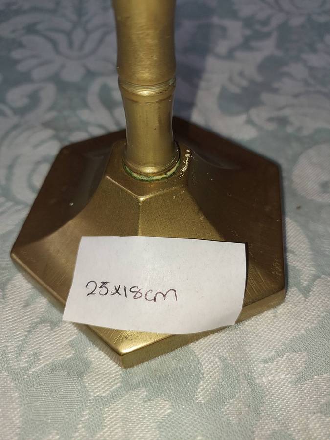 A BEAUTIFUL BRONZE MINORA SOLD AS IS