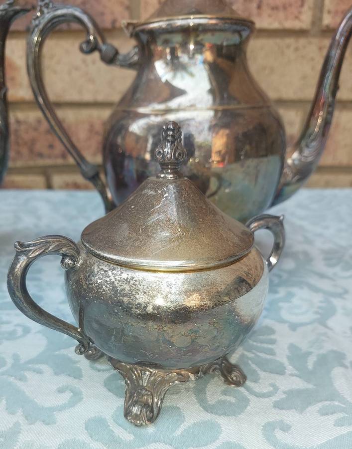 A VINTAGE EDWARDIAN FB ROGERS SILVER CO TEAPOT SET SOLD AS IS