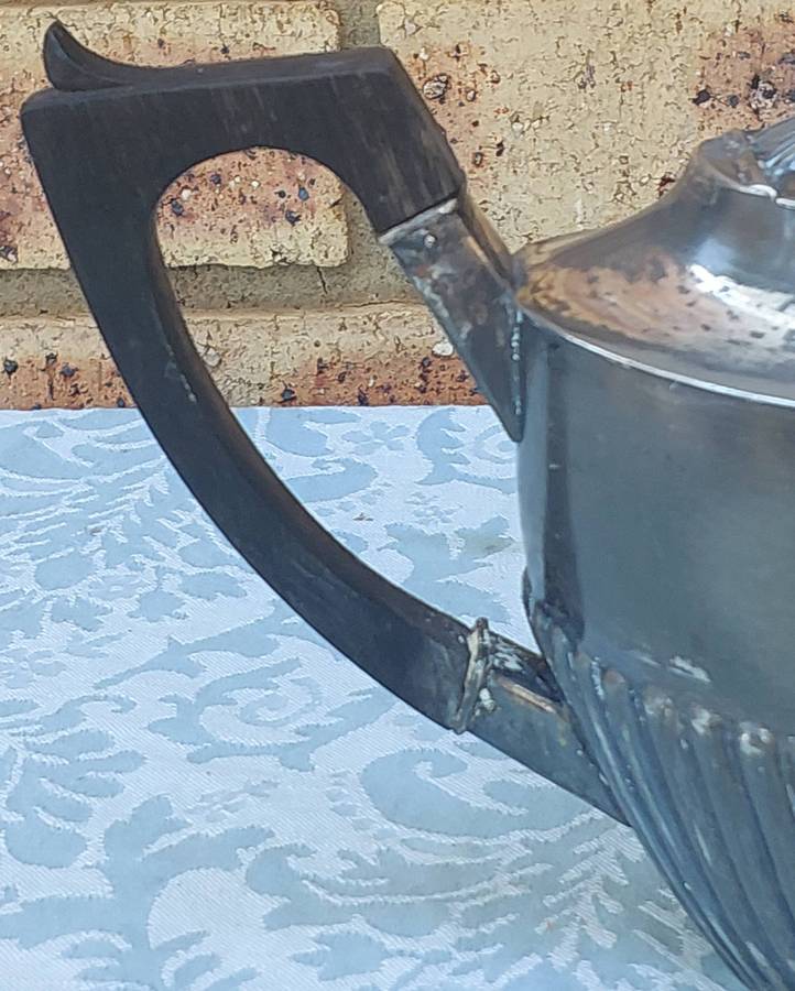 AN ANTIQUE TEAPOT EDWARDIAN SOLD AS IS