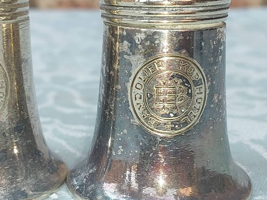 A VINTAGE COLLECTION SILVER PLATED UTENSIKS FROM BANDOLIERS KOP HOTEL SOLD AS IS
