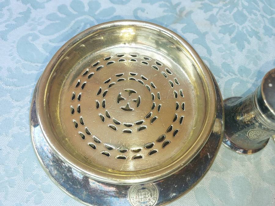 A VINTAGE COLLECTION SILVER PLATED UTENSIKS FROM BANDOLIERS KOP HOTEL SOLD AS IS