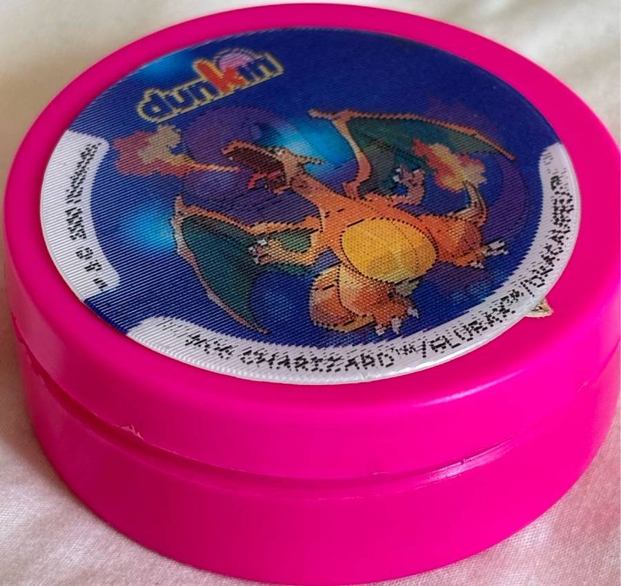 3x Pokémon 1997-2000 Nintendo Dunkin Morphing Tazos on pink containers