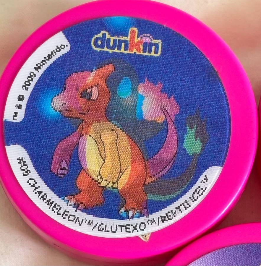 3x Pokémon 1997-2000 Nintendo Dunkin Morphing Tazos on pink containers