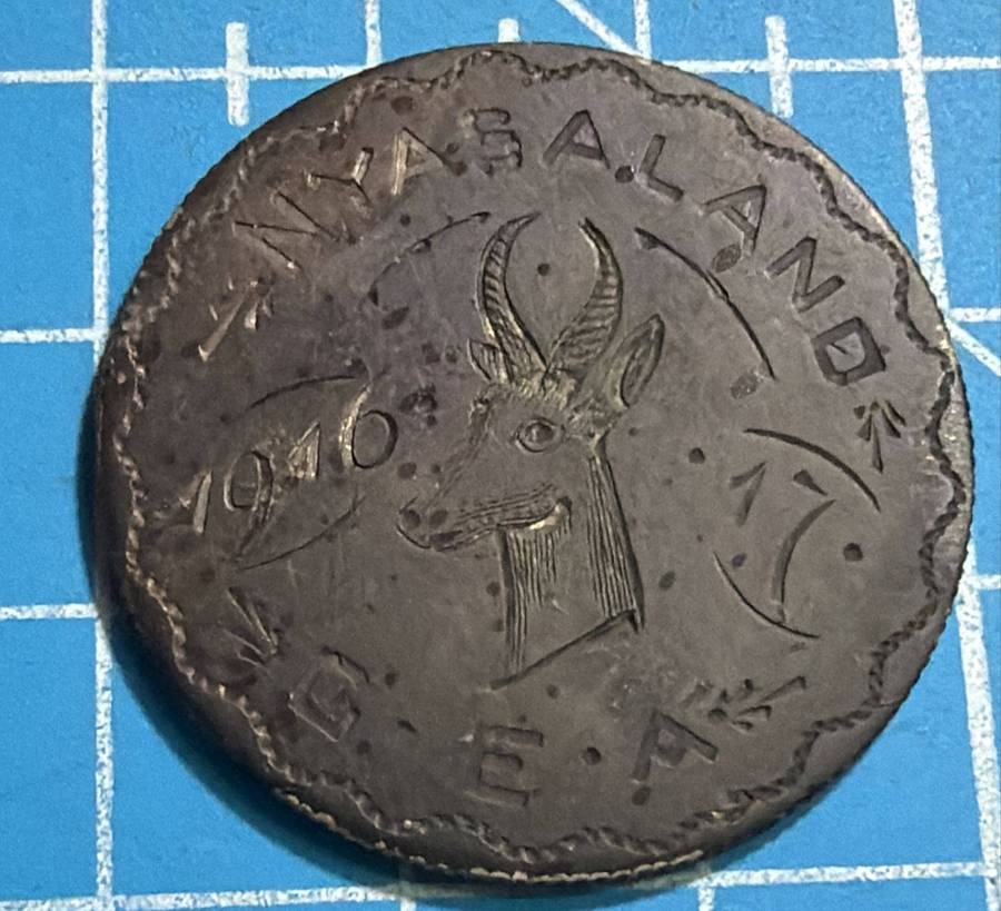 Nyasaland trench art coin on an east africa rupie
