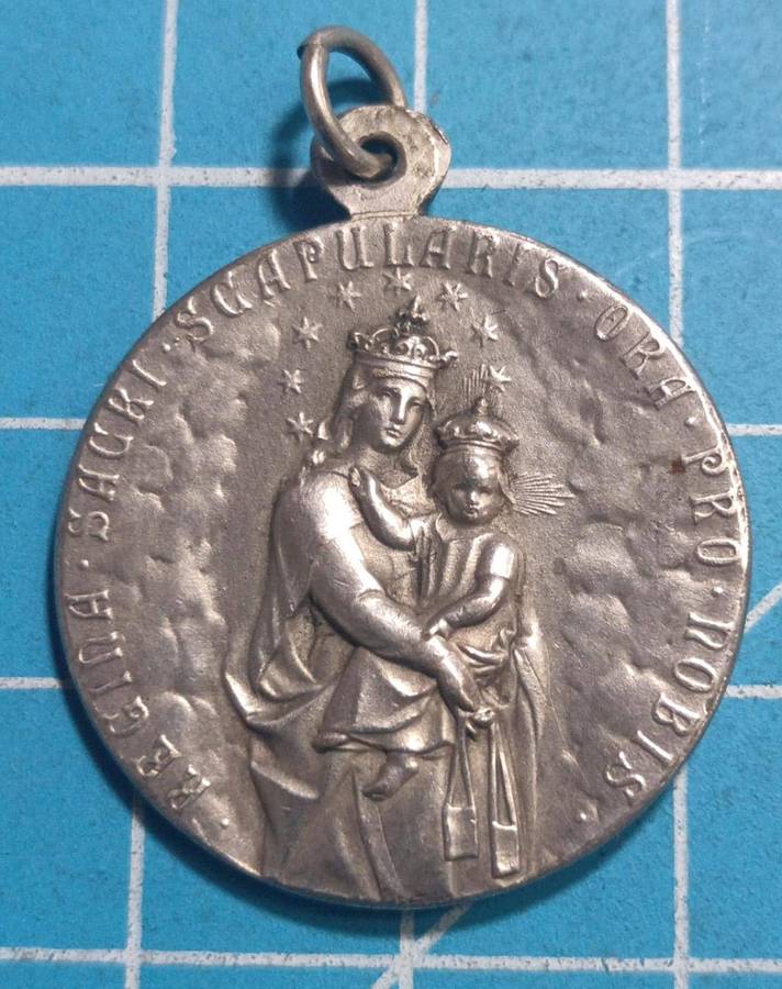 religious silver pendant