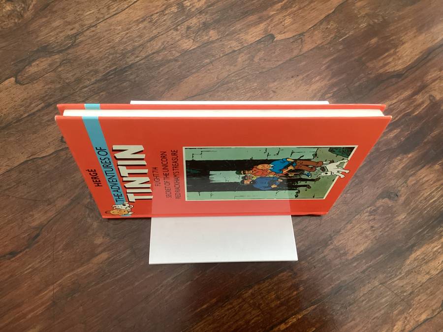 The Adventures of TINTIN (3 titles in one hardcover book). Excellent clean and fresh condition.