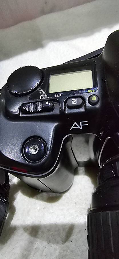 NIKON F601 CAMERA WITH LENS ,CASE AND A SPARE FILM ROLL