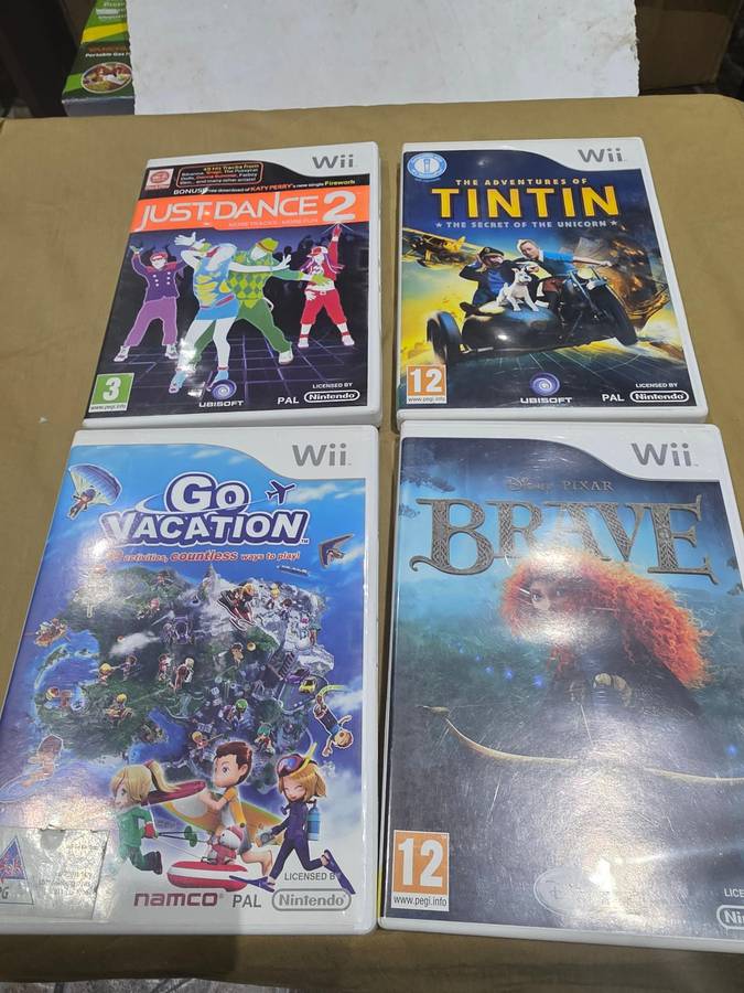 NINTENDO WII CONSOLE INCL.POWER SUPPLY, REMOTE ,8 GAME DISCS & ASSESCORIES