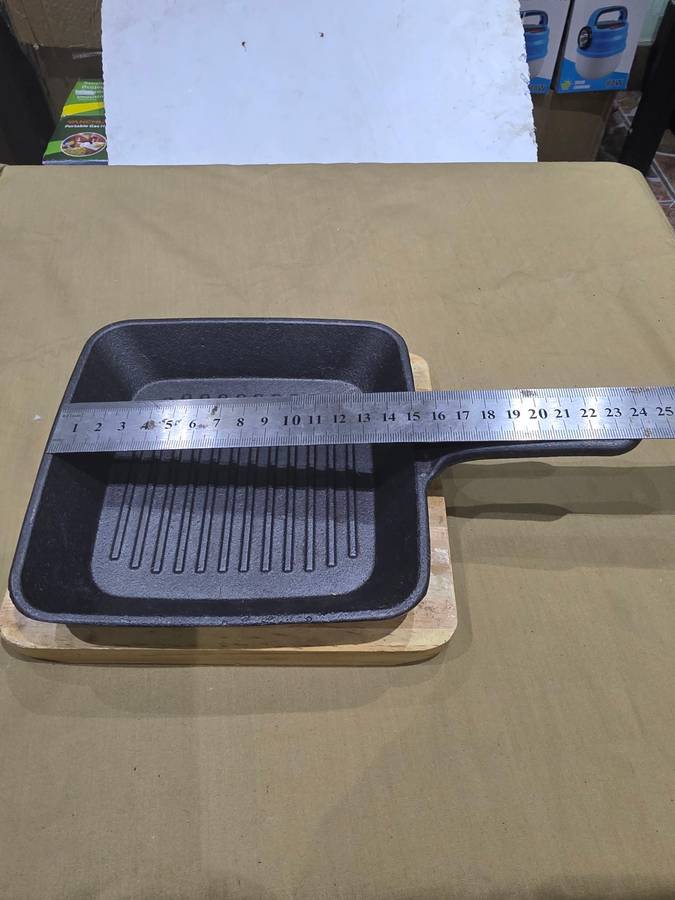 CAST IRON GRIDDLE PAN ON BOARD