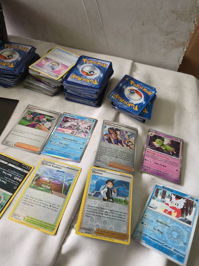 COLLECTION OF OVER 350 MIXED LOT POKEMAN CARDS INCL.A METAL POKEMAN CASE