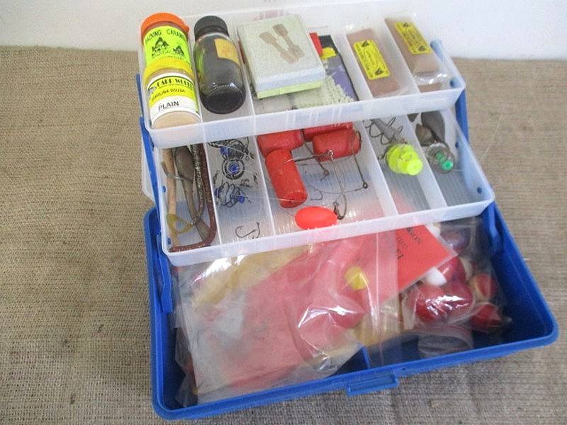 A Plastic Toolbox With A Variety Of Various Fishing Tackle Equipment