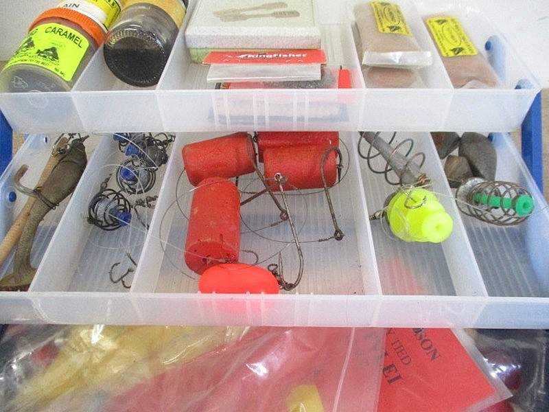 A Plastic Toolbox With A Variety Of Various Fishing Tackle Equipment