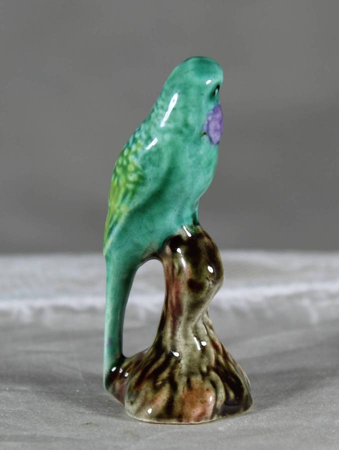 Miniature porcelain green parrot
