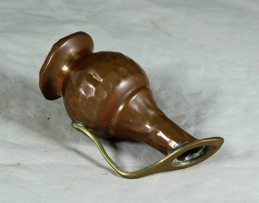 Small hand beaten copper jug