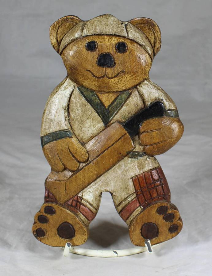 Large wooden bear cricket player wall hanging