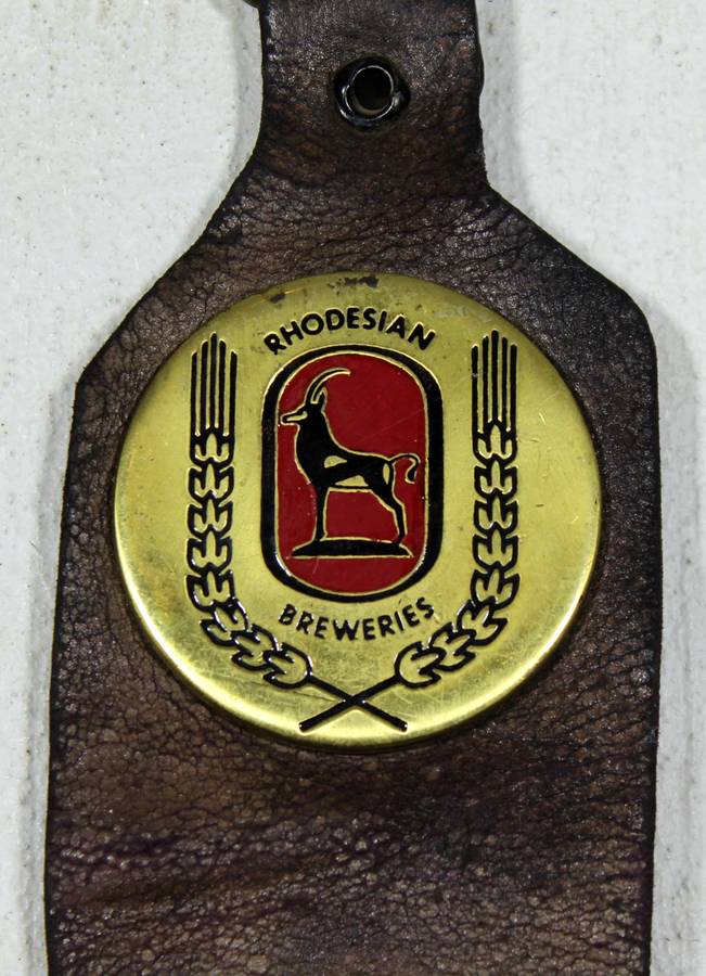 Rhodesian Breweries - Lion, Castel, Black Label brass medallions on leather strap