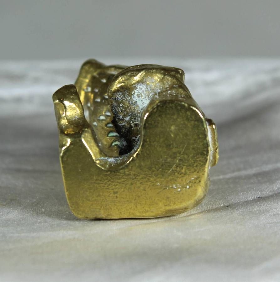 Miniature brass owl on a stump