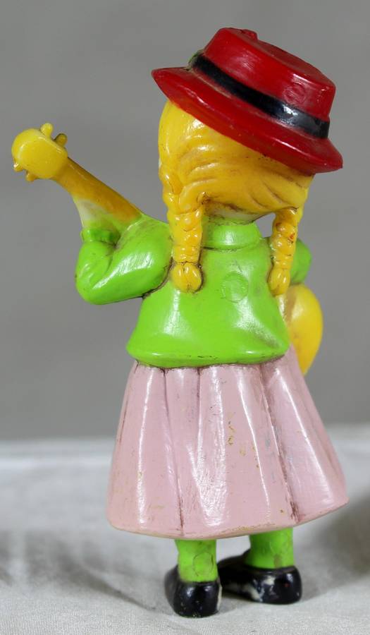Little girl playing a guitar