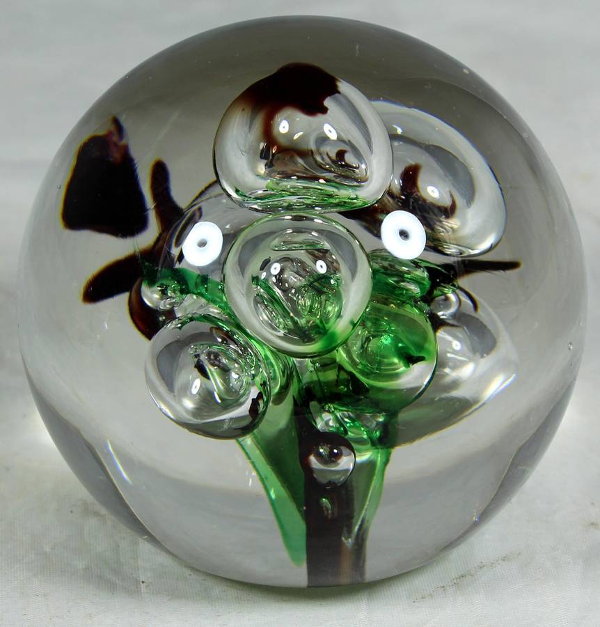 Glass paperweight with colorful bubbles