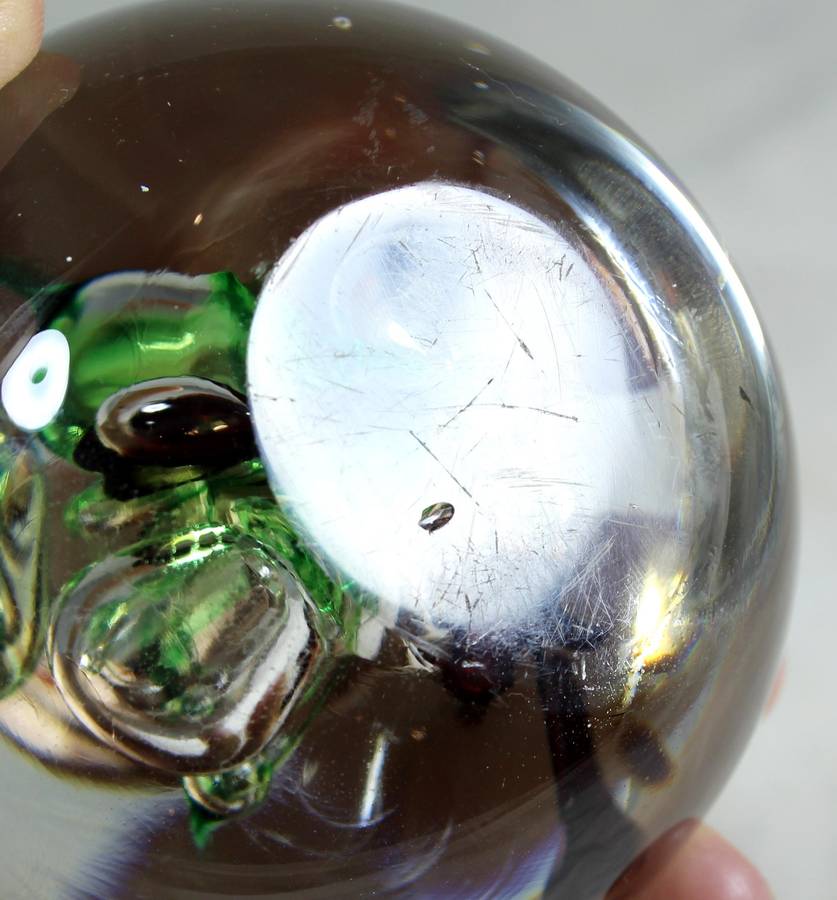 Glass paperweight with colorful bubbles