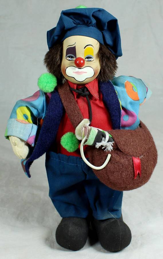 Tramp clown with a sling bag