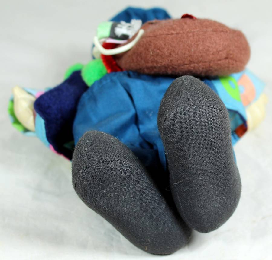 Tramp clown with a sling bag