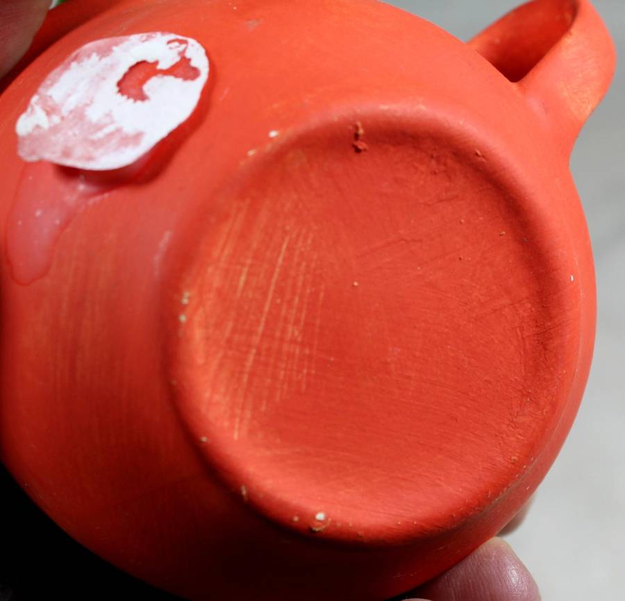 Ceramic cow in a cup