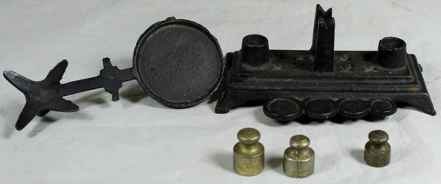 Small cast metal scale