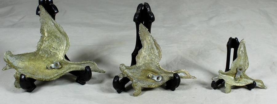 Trio of flying brass geese