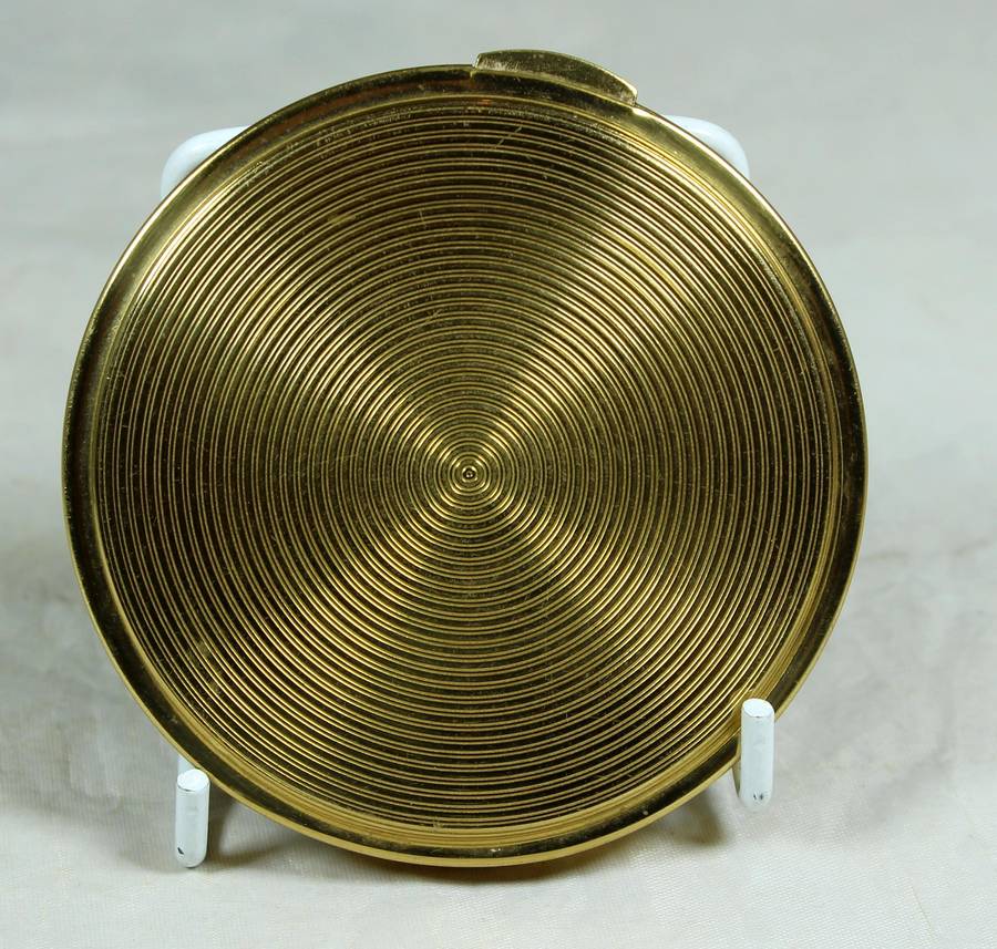 Gold tone powder compact