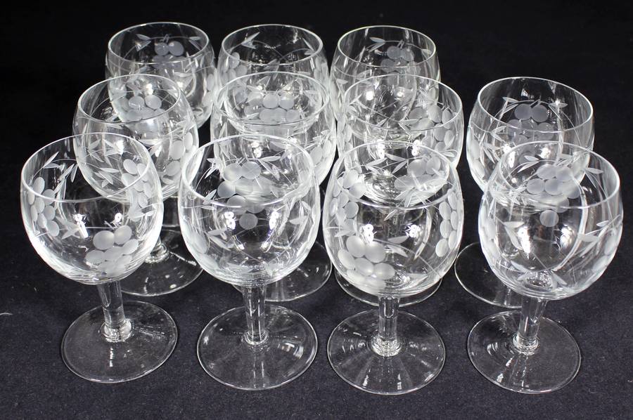 Set of eleven aperitif glasses with etched grapes motif