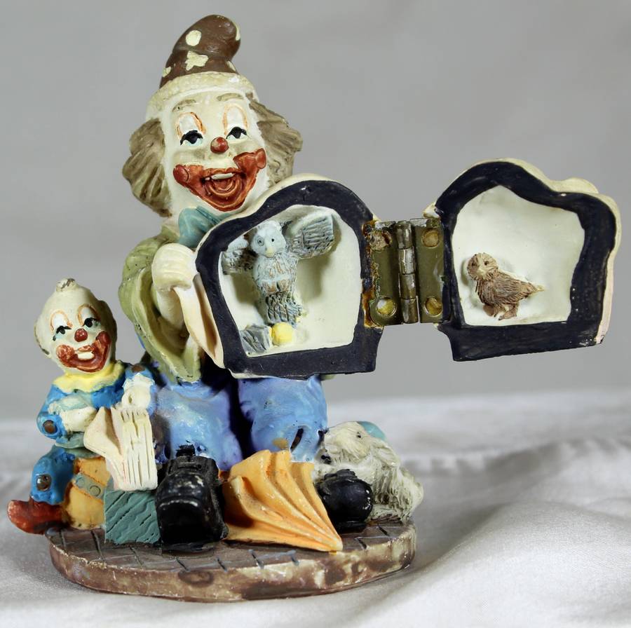Ceramic clown with magic pot